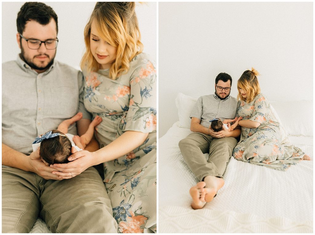 parents holding baby