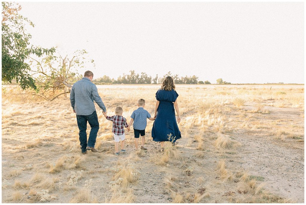 family holding hands and walking 