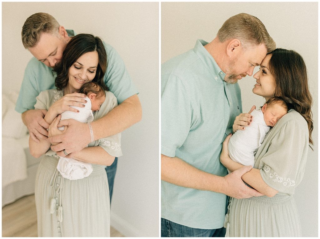 parents holding baby boy